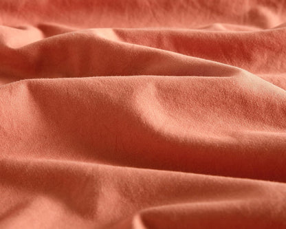 Luxurious terracotta microfibre fabric showcasing soft texture, perfect for vintage European pillowcases.