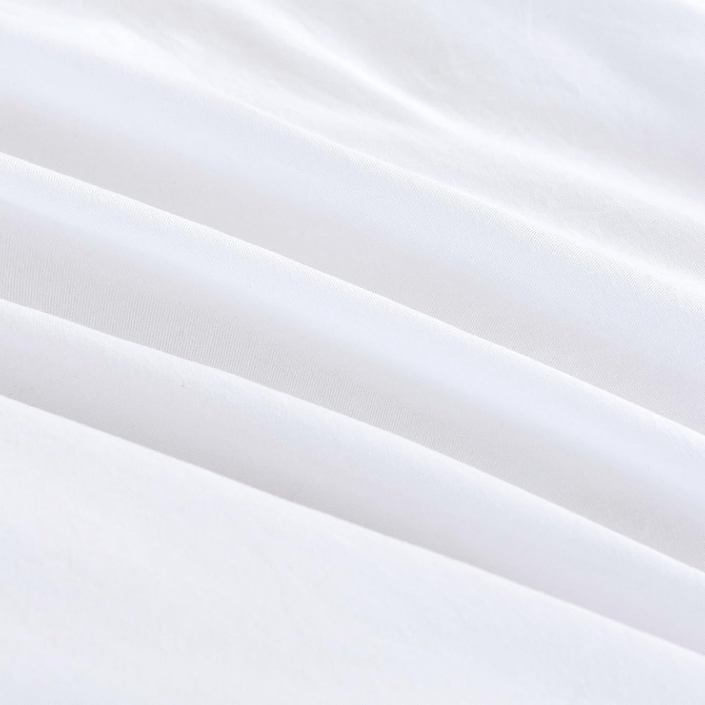 Luxurious white microfibre fabric of vintage washed European pillowcases, showcasing smooth and soft texture.