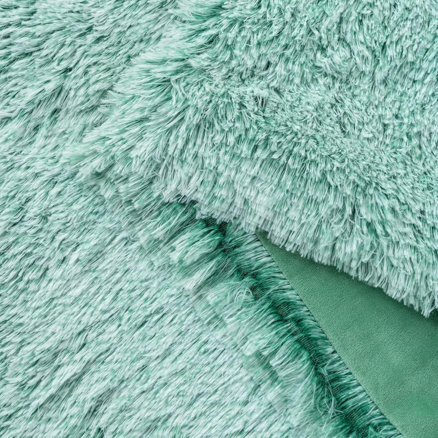 Emerald faux fur shaggy throw blanket, double-sided with plush texture and smooth microfibre velvet, perfect for cozy throws and blankets.