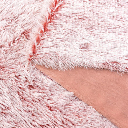 Rose double-sided faux fur throw blanket with shaggy and smooth textures, ideal for cozy home decor.