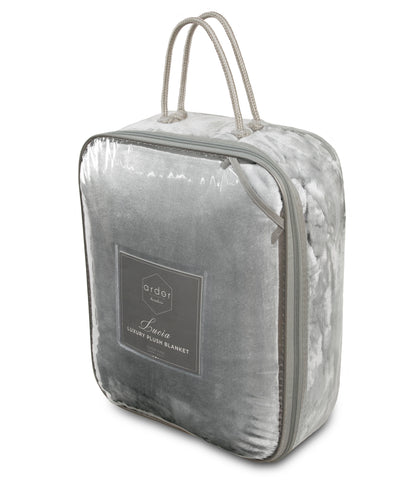 Lucia Luxury Plush Velvet Blanket in convenient storage bag, perfect for stylish home decor and comfort.