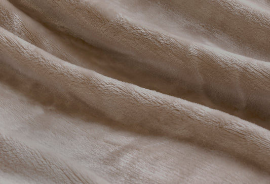 Close-up of luxurious plush velvet fabric, showcasing soft texture and warmth of a premium throw blanket.