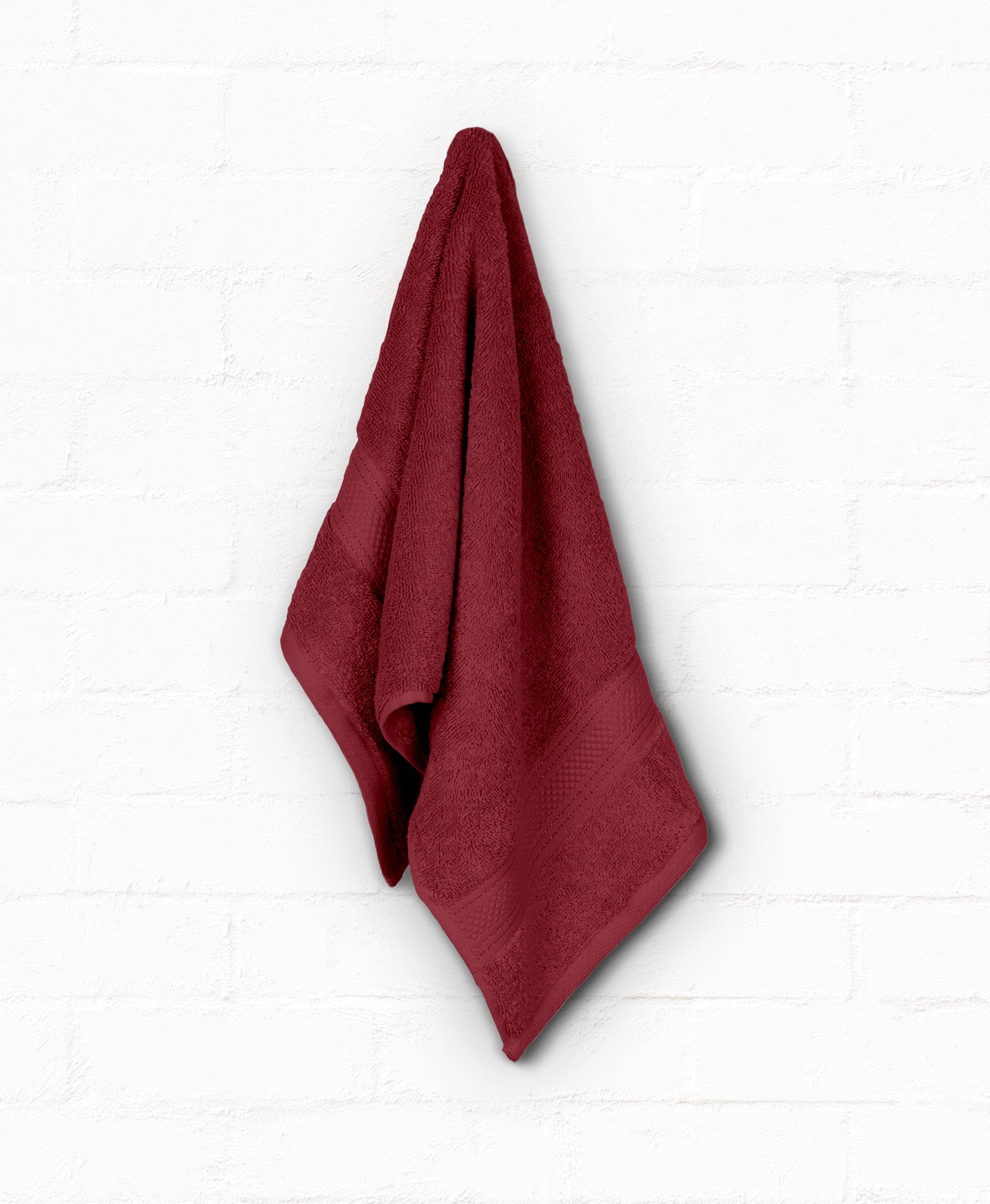 Luxurious burgundy 100% cotton bath towel from St. Regis 7-piece collection, perfect for enhancing bathroom style and comfort.