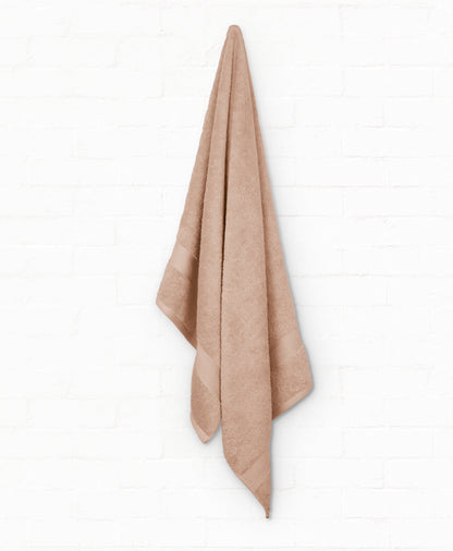 Luxury Peach cotton bath towel from St. Regis 5-piece collection, perfect for elegant bathroom decor and superior absorbency.