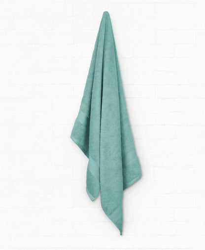 Luxury teal cotton bath towel from the 7-piece St. Regis collection, perfect for enhancing bathroom style and comfort.