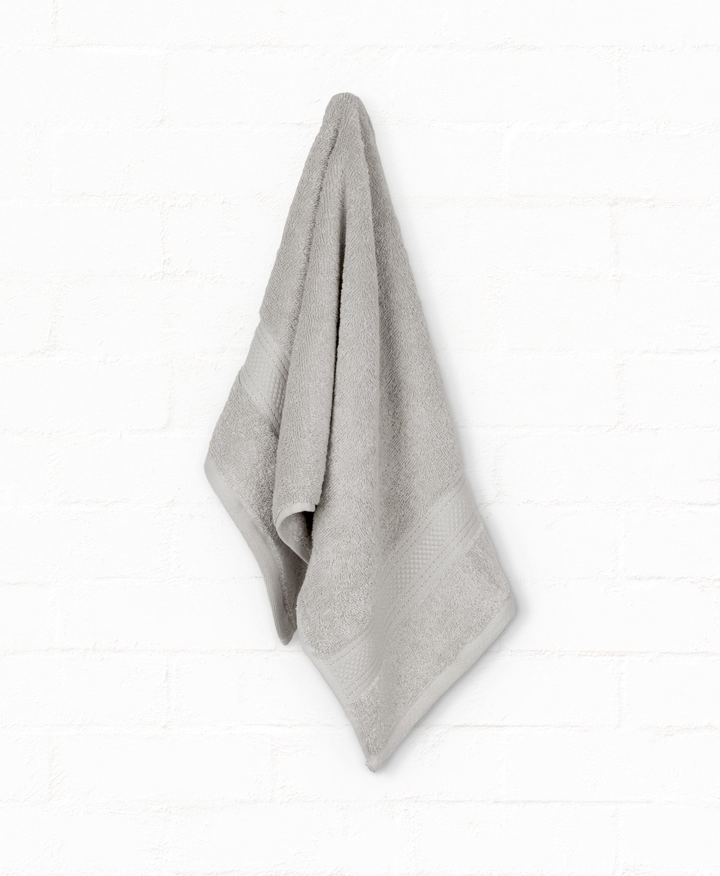 Grey luxury cotton bath towel from St. Regis 7-piece set, perfect for bathroom style and comfort.