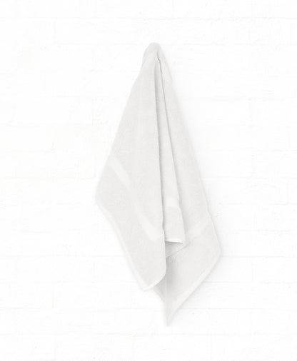 White St. Regis cotton bath towel from 7-piece luxury collection, perfect for bathroom elegance and comfort.