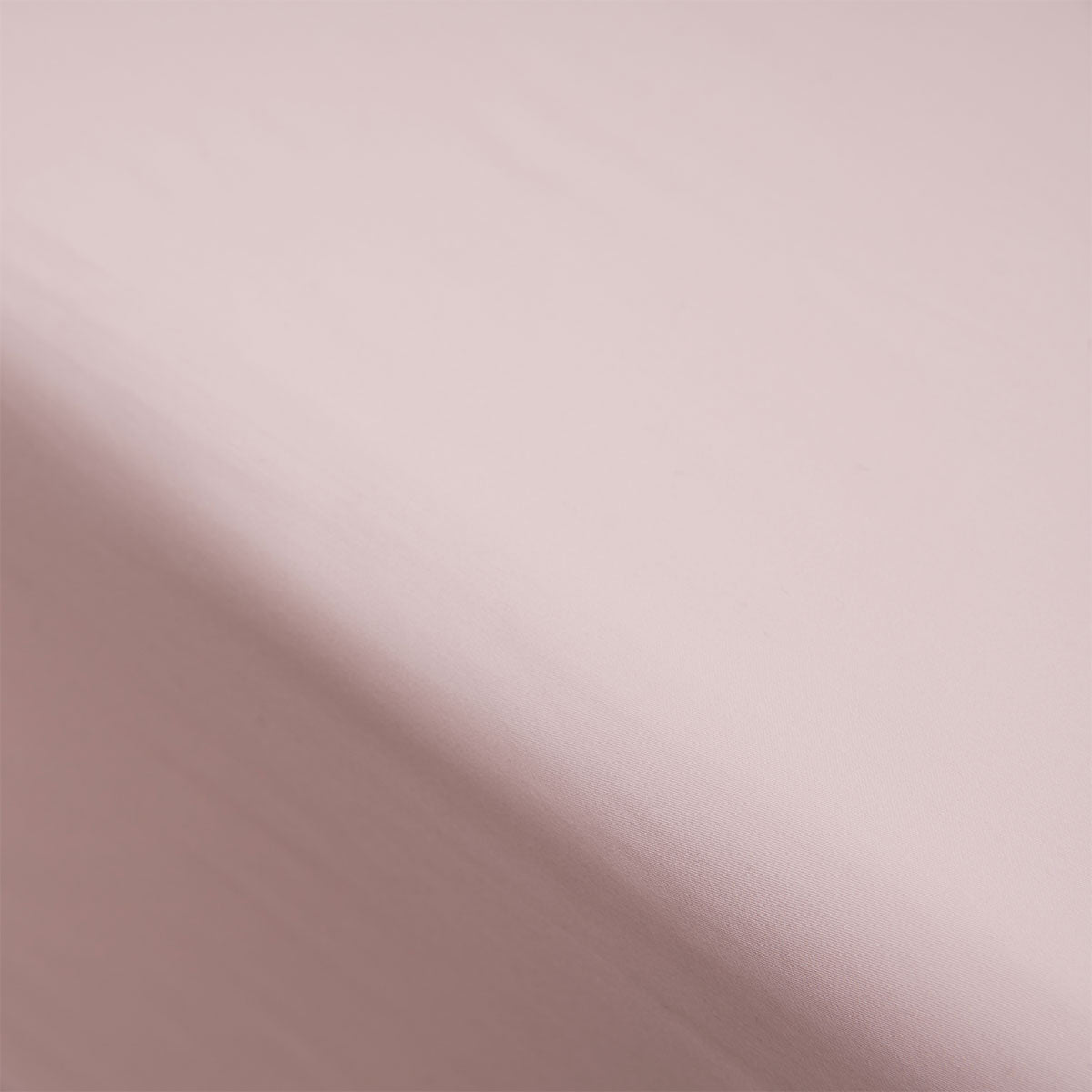 Close up view of the soft and breathable fabric of the 400TC Blush Bamboo Cotton Fitted Sheet, highlighting its premium quality as a cotton bedsheet.
