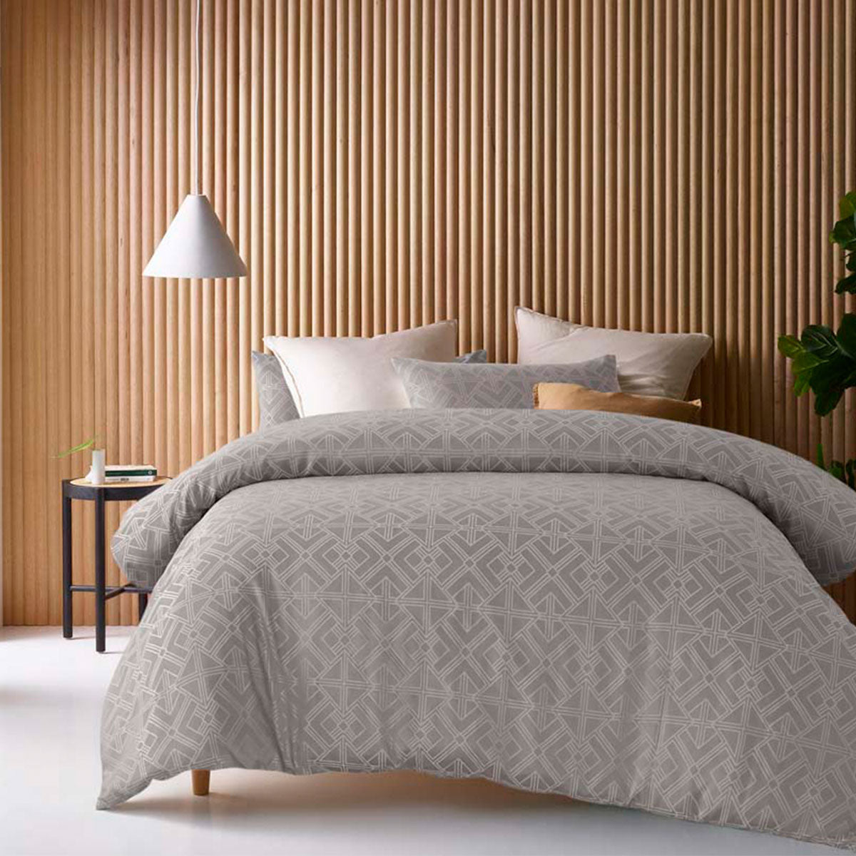 Elegant taupe and silver geometric jacquard quilt cover set on a stylish bed, enhancing bedroom decor with sophistication.