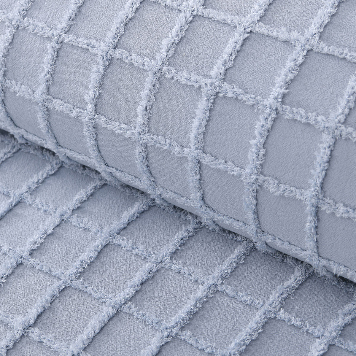 Close-up of the blue quilt cover's texture, highlighting the natural cotton fabric and detailed stitching, emphasizing comfort and quality.
