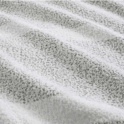 Close-up of the textured chenille fabric in grey tones from Ardor Liam quilt cover set. Ideal for stylish bedding.