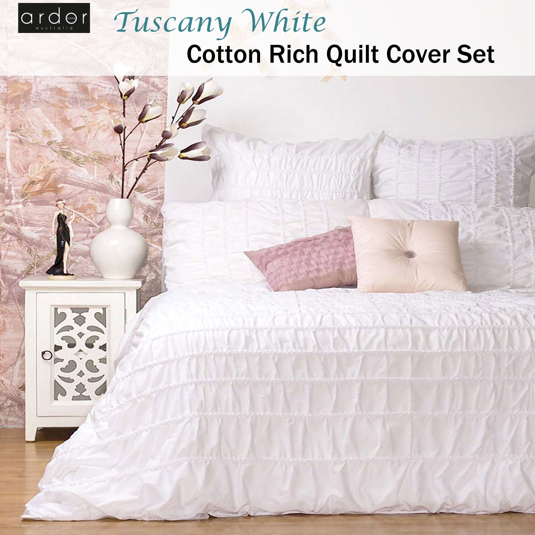 Tuscany White Cotton Quilt Cover Set on a bed with decorative pillows, enhancing bedroom style and comfort.