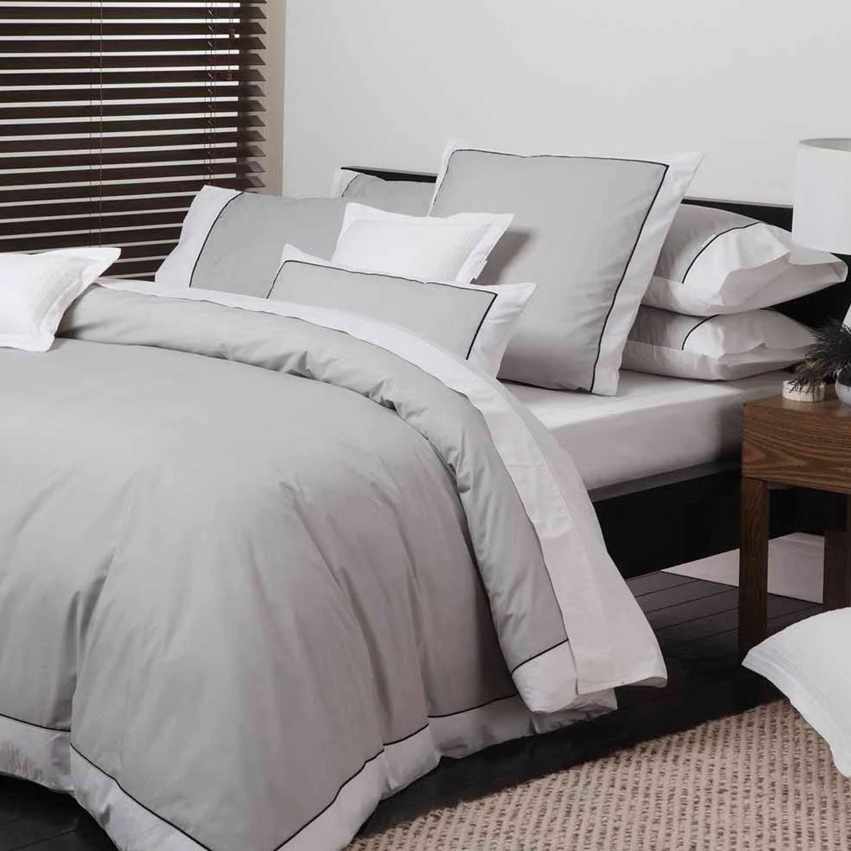 Logan and Mason Essex Pewter Cotton-rich Percale Quilt Cover Set King with a herringbone pattern and contrast white border.