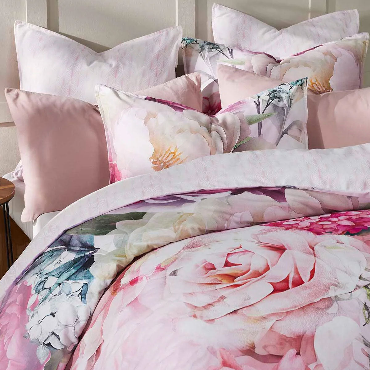 Logan and Mason 250TC Summer Daze pink cotton quilt cover set with floral print and matching pillows for a stylish bedroom.