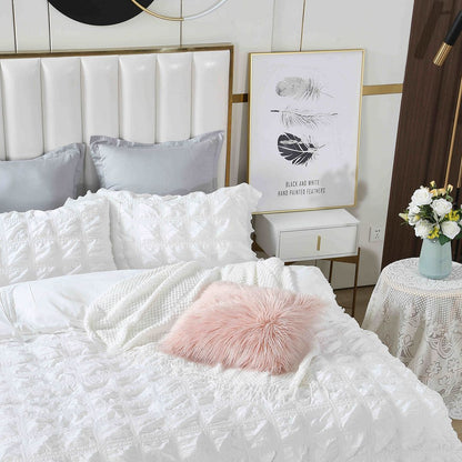 Cozy bedroom featuring a white Ruffles Textured Jacquard duvet cover set with decorative pillows and a chic bedside table.