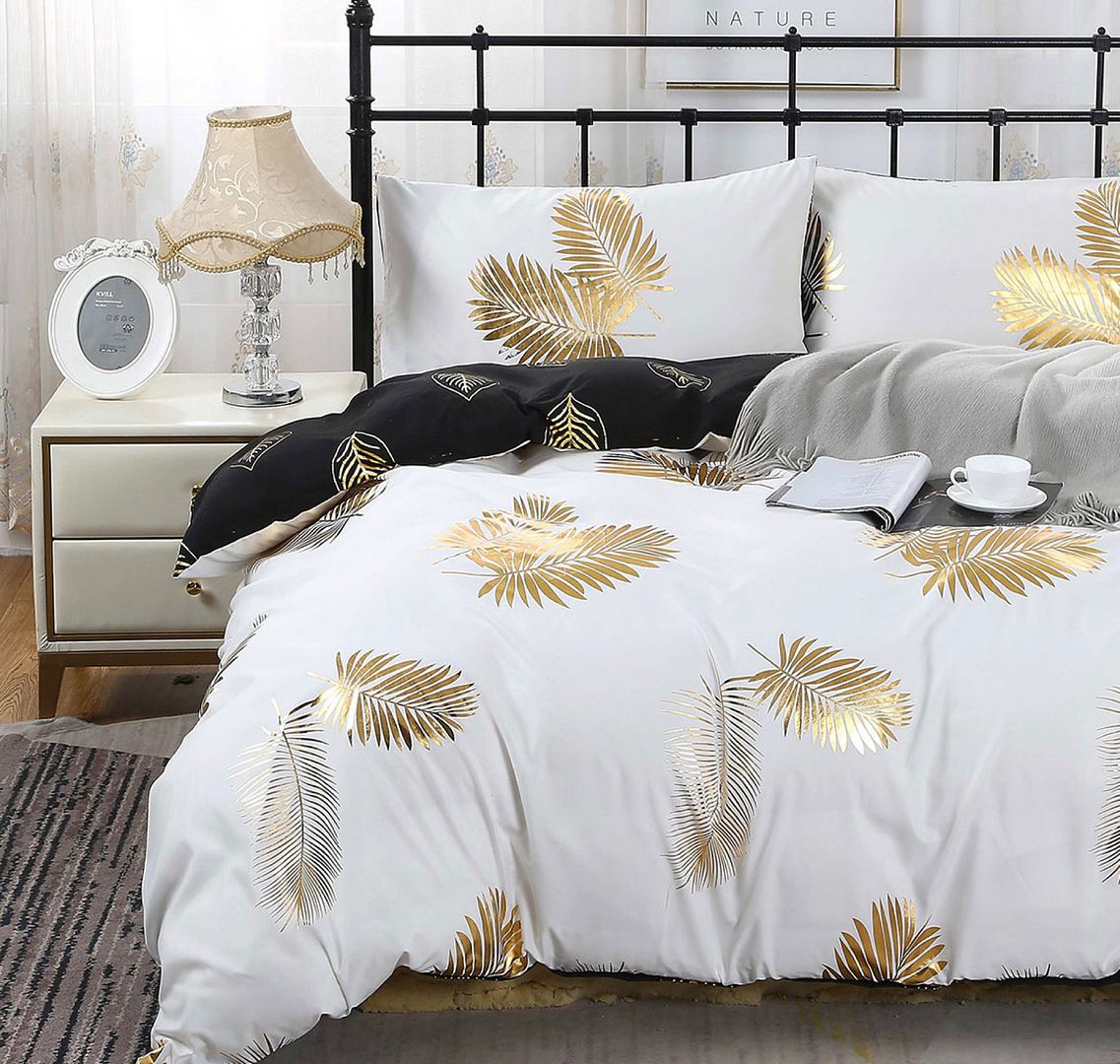 Aesthetic reversible quilt cover set featuring palm leaf design in gold and white, perfect for king size beds and seasonal comfort.