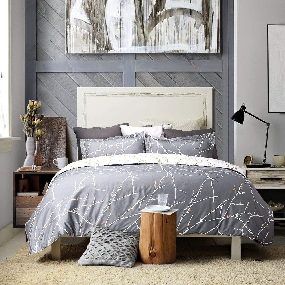Tree Reversible Grey Super King Quilt Cover Set showcasing comfort and luxury in a stylish bedroom setting.