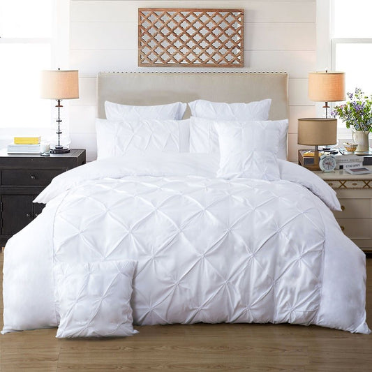 Elegant white diamond pintuck quilt cover set with matching pillows, perfect for a stylish bedroom makeover.