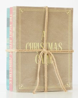 Christmas Classics book stack wrapped with twine, perfect for festive decor and holiday displays.