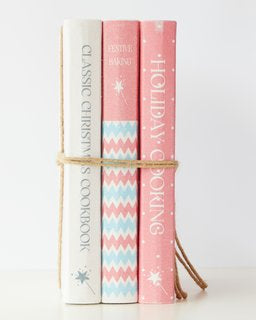 Charming Christmas book stack of faux cookbooks, perfect for festive home decor and holiday celebrations.