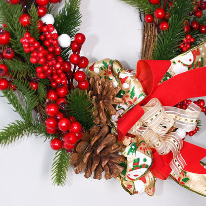 Christmas wreath decorated with pine cones, red berries, and a festive bow for holiday door decor.