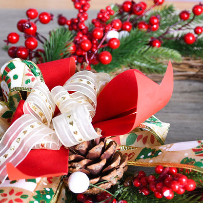 Close-up of a festive Christmas wreath featuring pine cones, red berries, and a decorative ribbon bow.