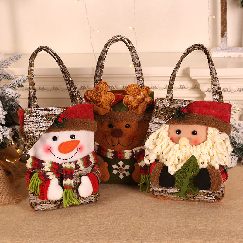 Adorable 3 PCS Christmas gift bags featuring Santa, snowman, and reindeer designs for holiday treats and presents.