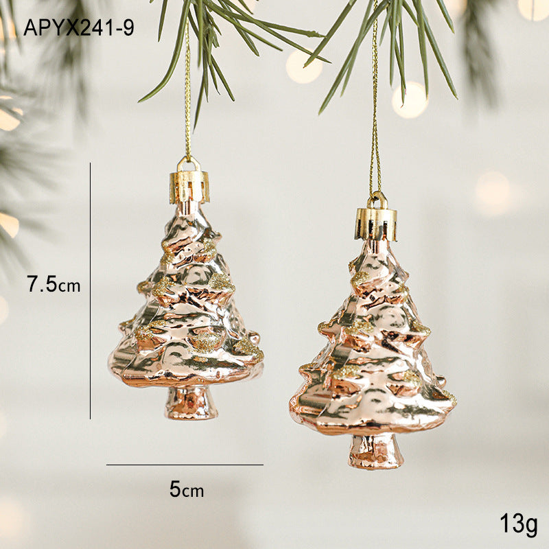 Elegant gold and rose gold Christmas ornaments hanging on a tree, perfect for festive tree decorations.