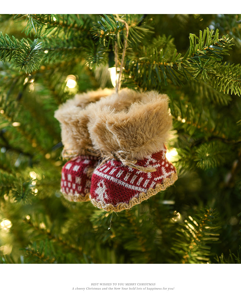 Knitted Christmas boot ornament with faux fur trim hanging on a festive Christmas tree, perfect for holiday decorations.