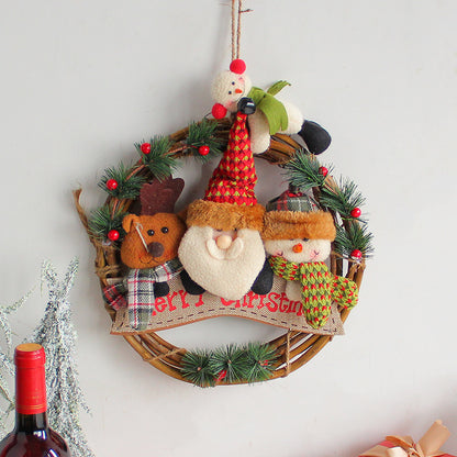 Rustic Christmas wreath featuring Santa, a reindeer, and a snowman, adorned with greenery and festive decor.