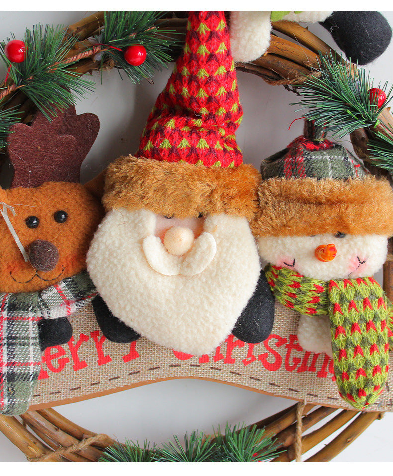 Rustic Christmas wreath featuring Santa, a reindeer, and a snowman with festive greenery and a "Merry Christmas" sign.