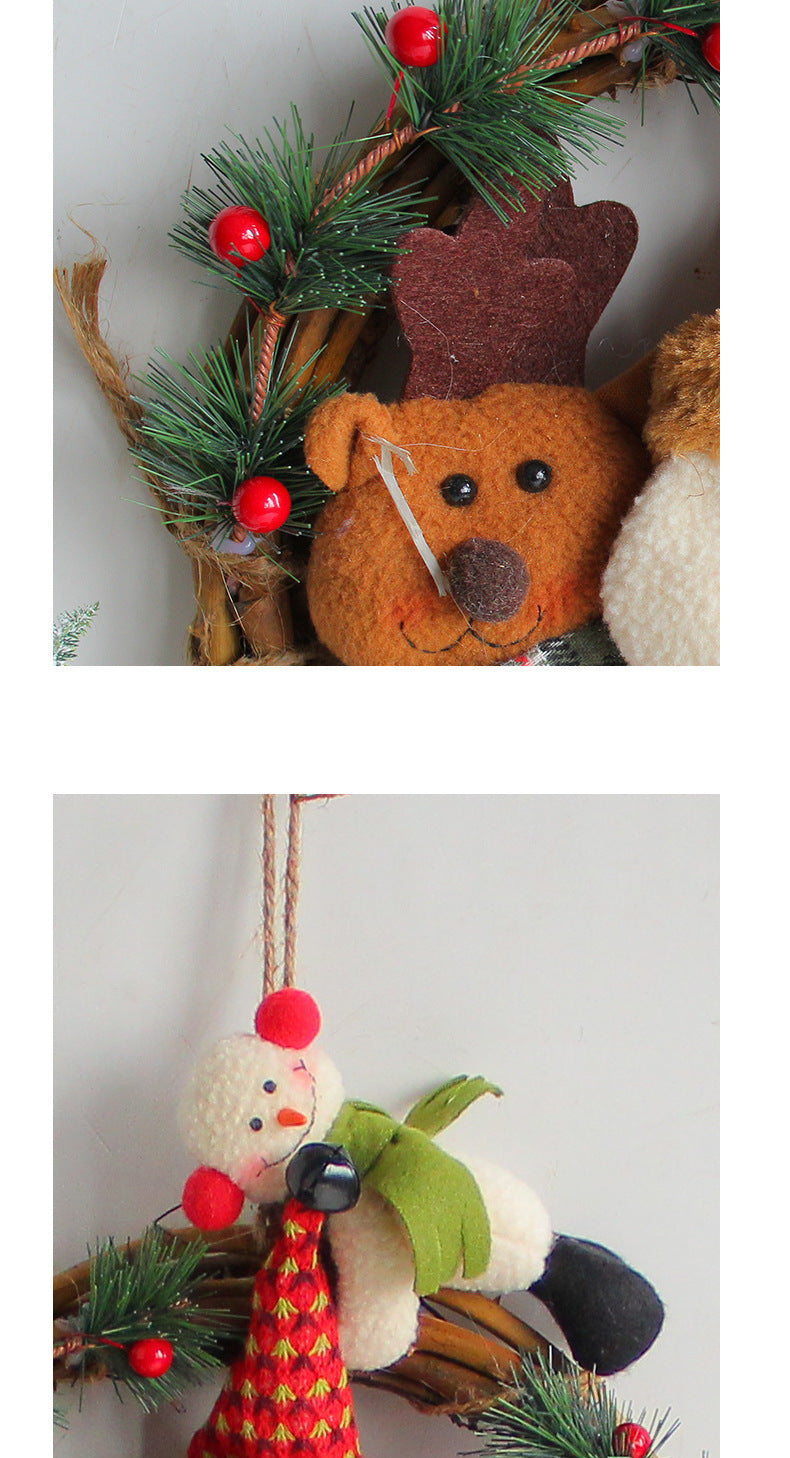 Rustic Christmas wreath featuring a reindeer, snowman, and festive greenery for holiday door decoration.