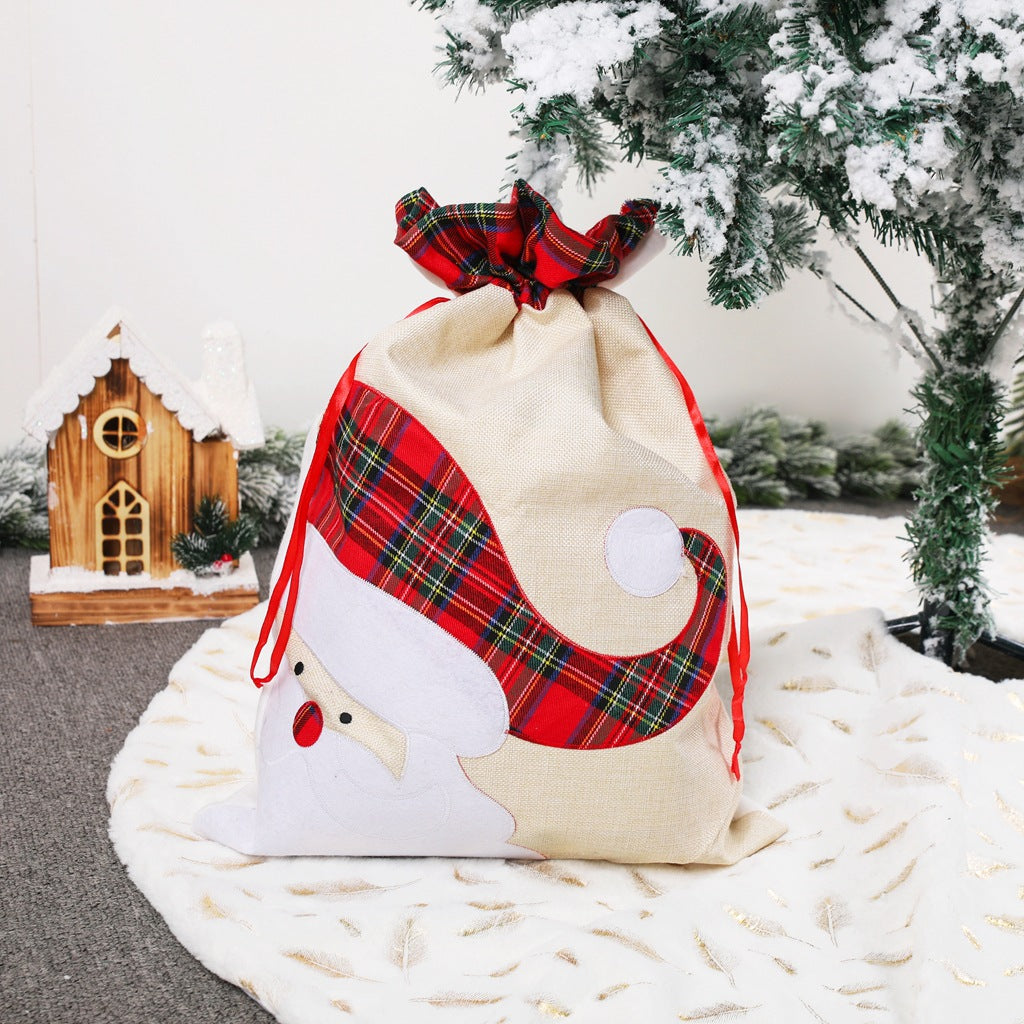 Large Santa Claus gift bag with plaid design, perfect for Christmas gifts and holiday presents.